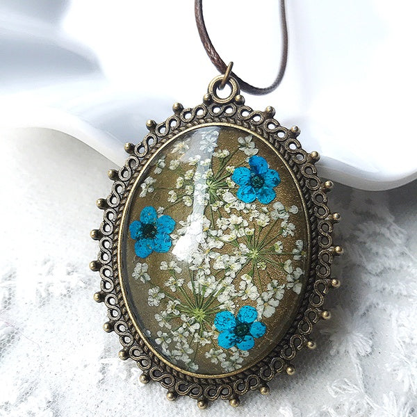 Glass-Preserved Neon Blue+White Flowers in a Textured Bronze Frame Necklace